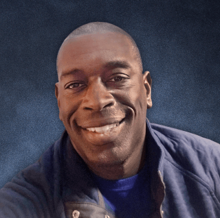 Headshot of a man smiling to camera